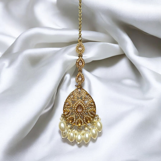 Ivory Trina Jadau Jhumkis with Kaanchain and Maangtikka